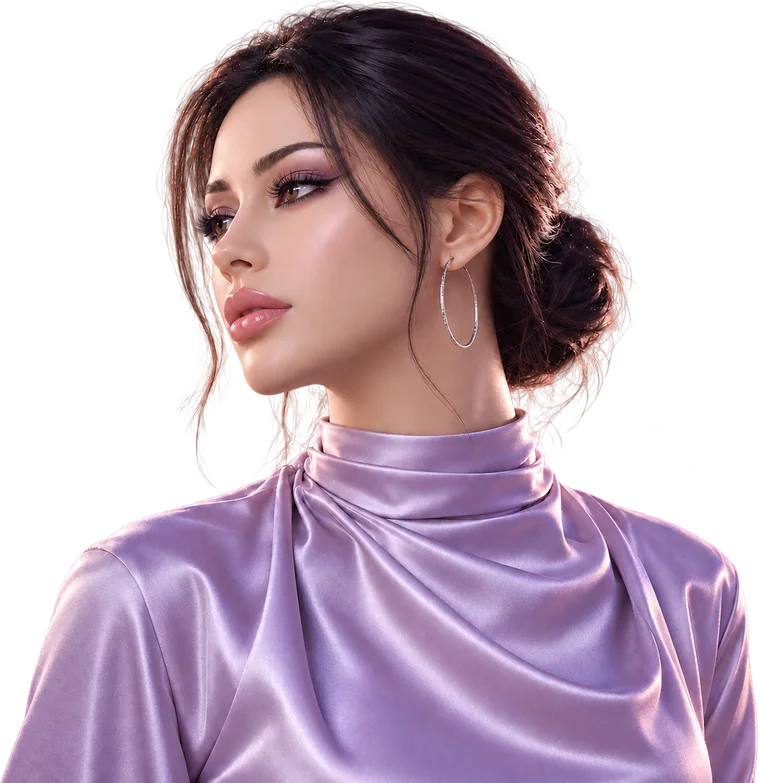 Realistic doll with dark hair in a low bun and a silver hoop earring, wearing a lilac satin high-neck top